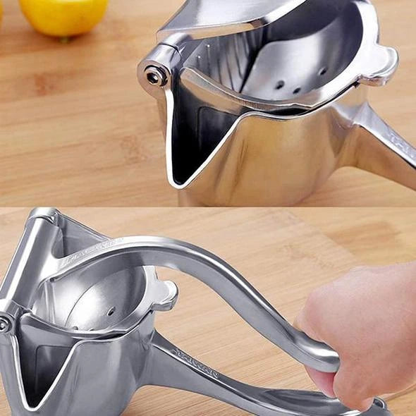 Details van de zilveren handmatige fruitpers
