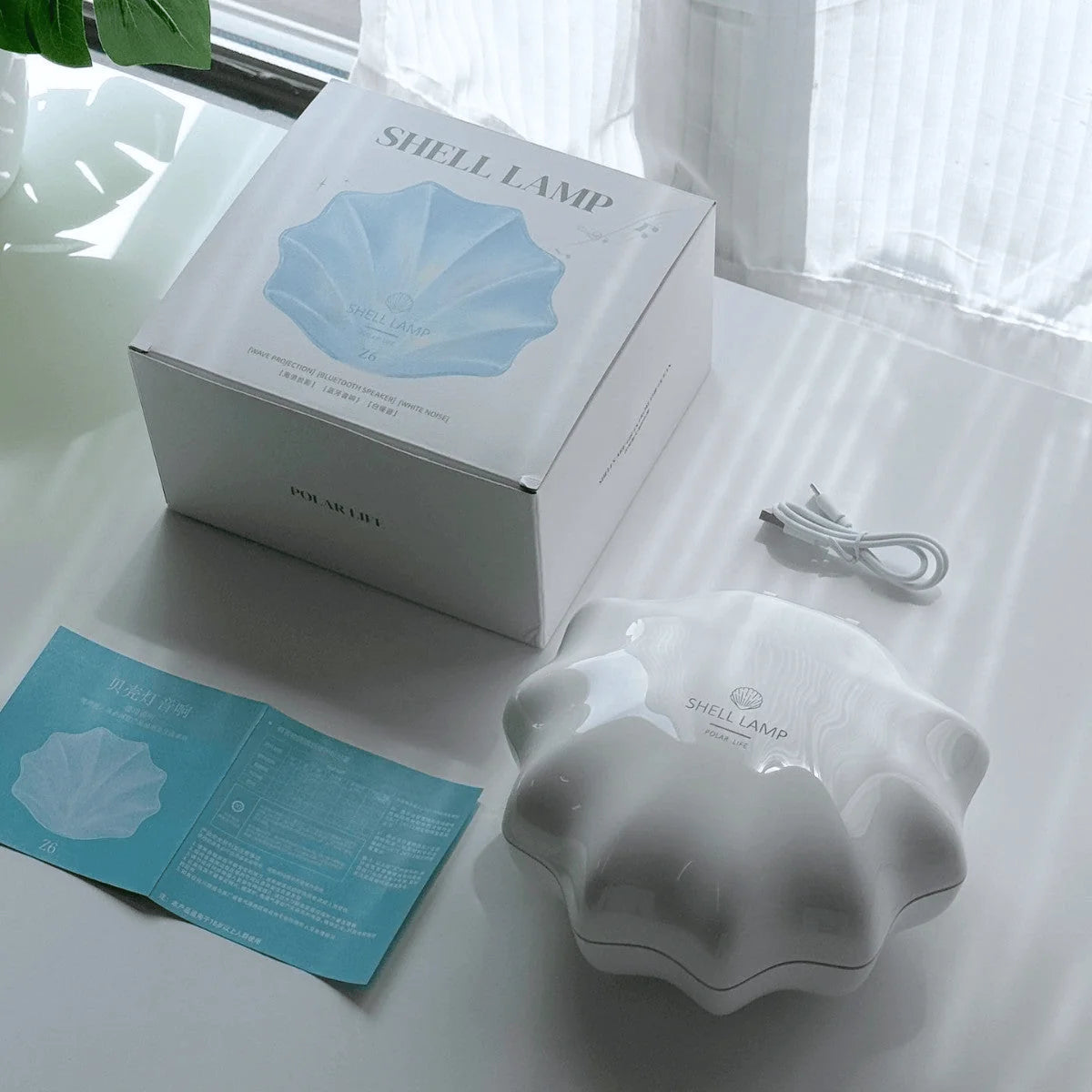 WaveShell speakerlamp met sfeervolle lichtprojectie